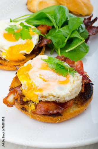 Eggs benedict with bacon and spinach