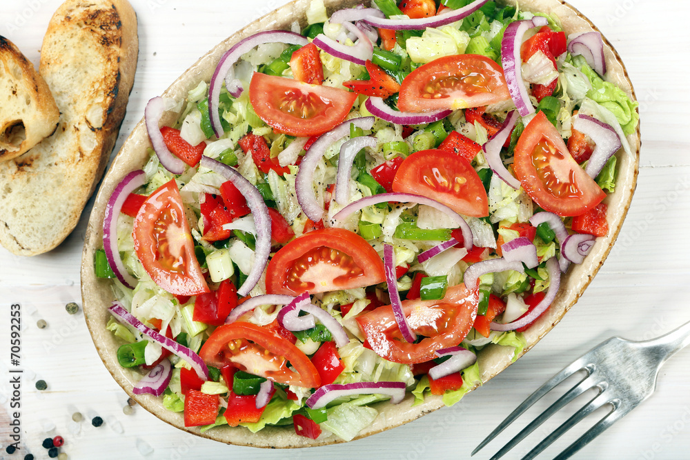 Fresh salad with croutons on wooden background Fresh salad with croutons on wooden background