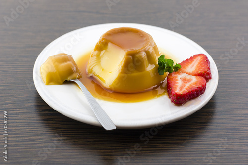 Canvastavla Creme caramel vanilla custard dessert or flan on white dish with