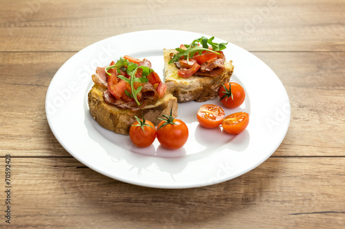 Plate With Italian Bruschetta On Table