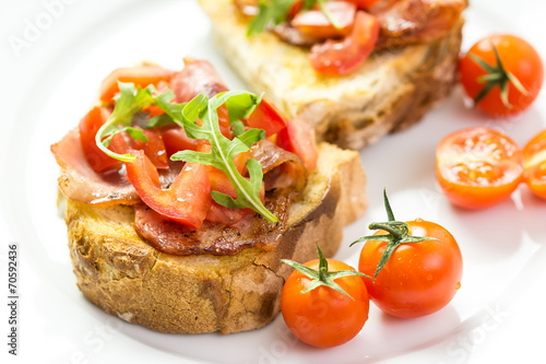 Bruschetta Grilled Bread, Prosciutto, Rucola And Cherry Tomatoes