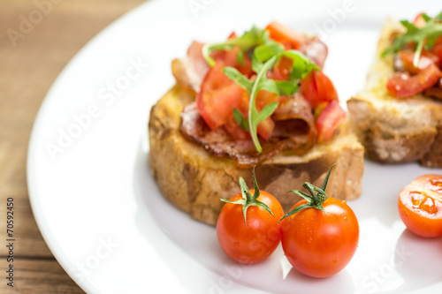 Bruschetta Grilled Bread, Prosciutto, Rucola And Cherry Tomatoes