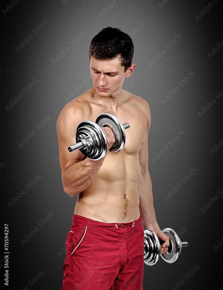 man lifting dumbbells man lifting dumbbells
