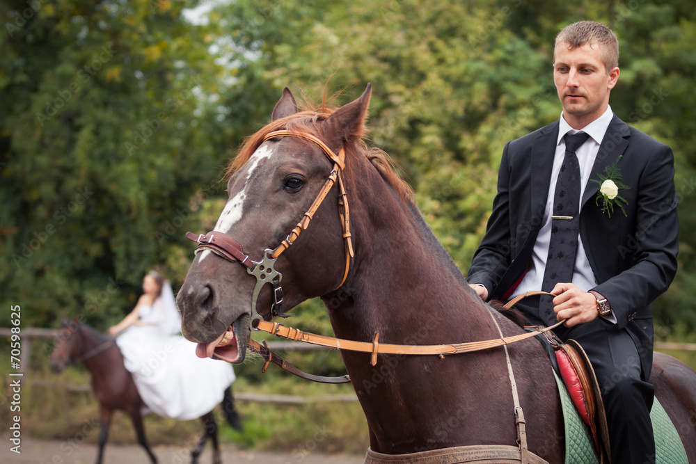 Fototapeta premium groom on horse
