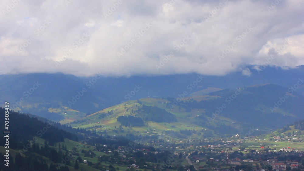 village in mountains under clouds. beautiful landscape village in mountains under clouds. beautiful landscape