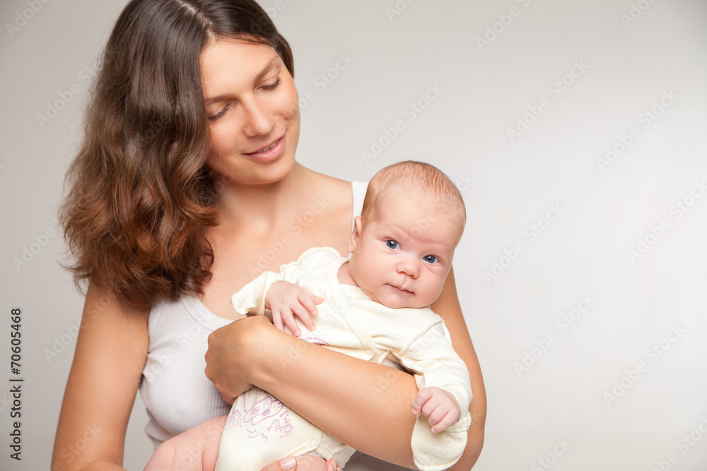 happy mother holding and hugging her baby happy mother holding and hugging her baby