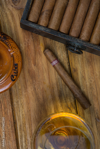 Tableau sur toile Cigars and Rum or alcohol on table