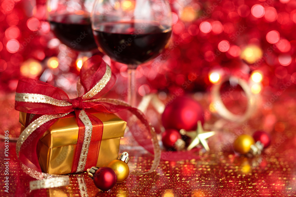 Gift and wine for holidays against blured lights. Gift and wine for holidays against blured lights.
