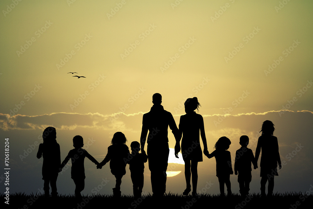 big family at sunset