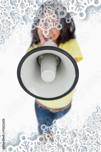 Close up of a megaphone holding by a young woman