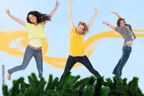 Attractive young man and women jumping for joy