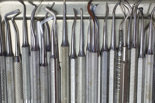 Dentist tools on a stainless plate
