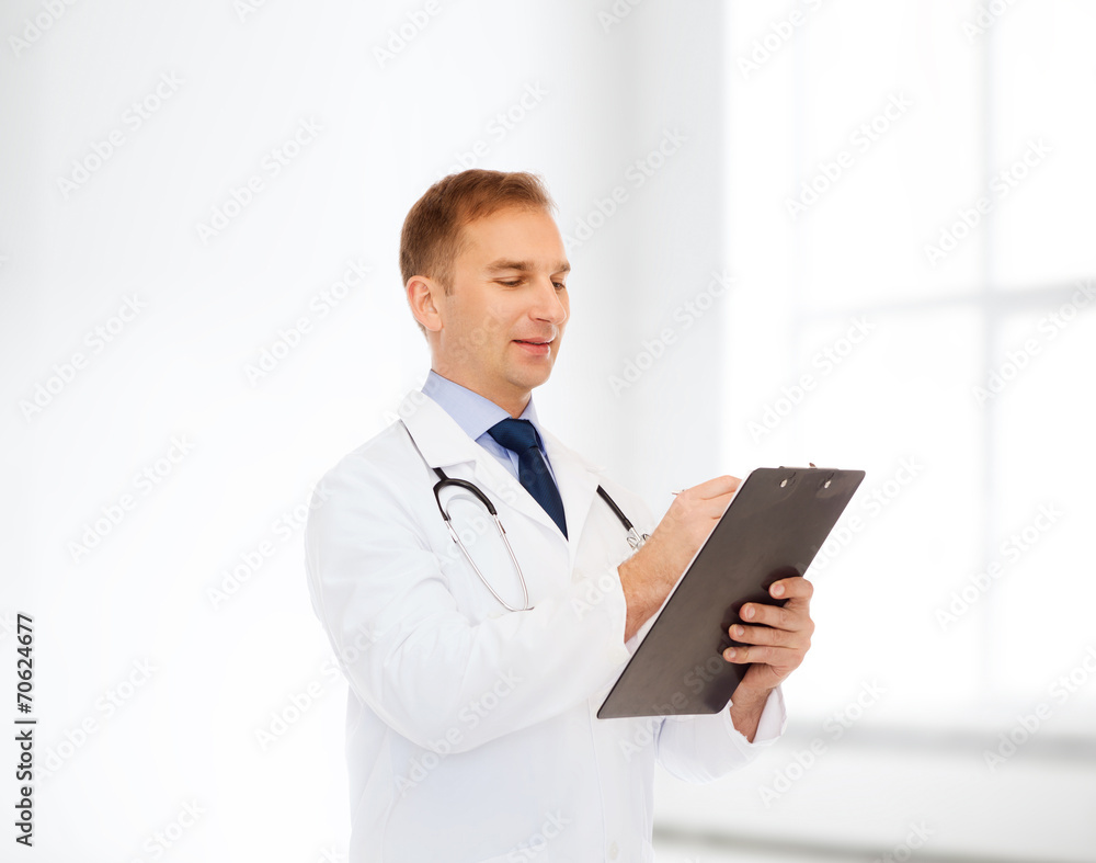 smiling male doctor with clipboard and stethoscope smiling male doctor with clipboard and stethoscope