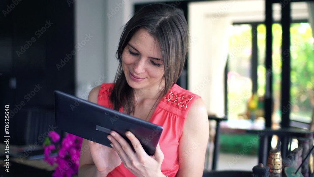 Young beautiful woman with tablet computer at home Young beautiful woman with tablet computer at home
