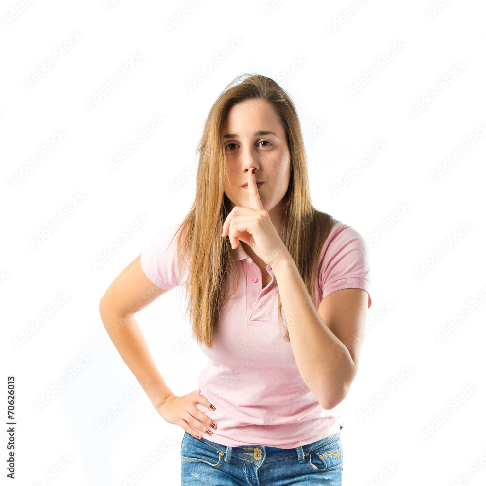 Girl making silence gesture over isolated white background Girl making silence gesture over isolated white background