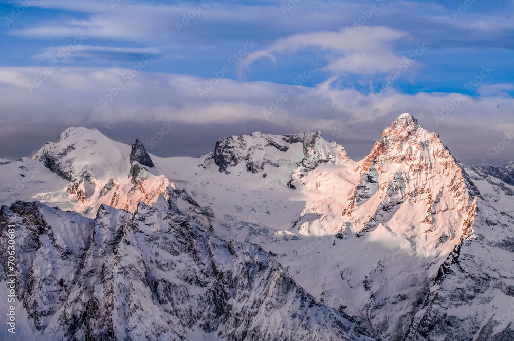 Obraz premium The mountains of Dombai and sky