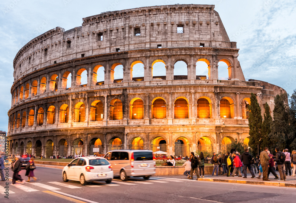 ROME - NOVEMBER 2, 2012: Tourists enjoy Colosseum at night. More
