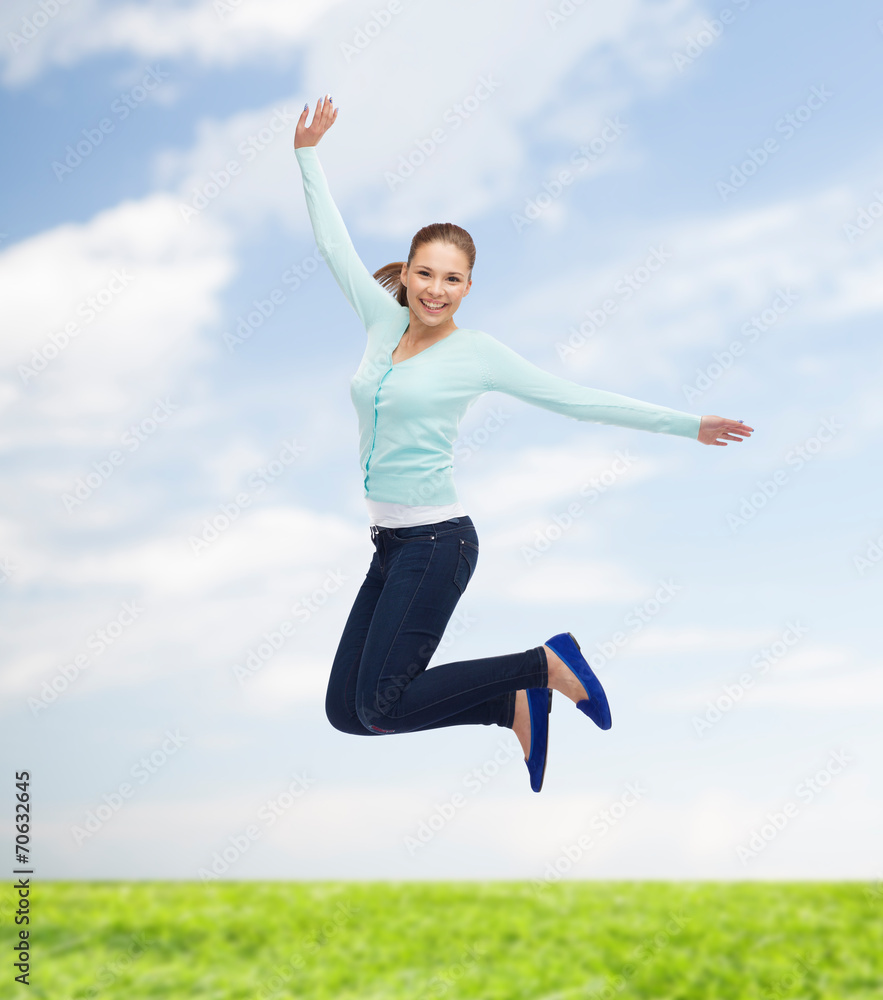 smiling young woman jumping in air