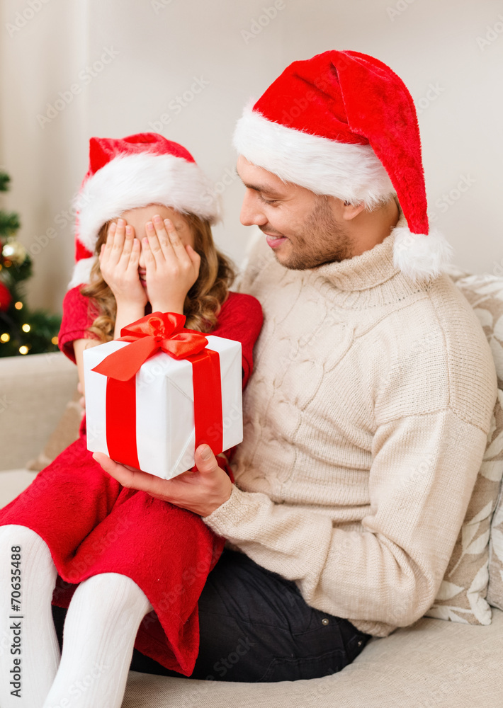smiling daughter waiting for a present from father smiling daughter waiting for a present from father
