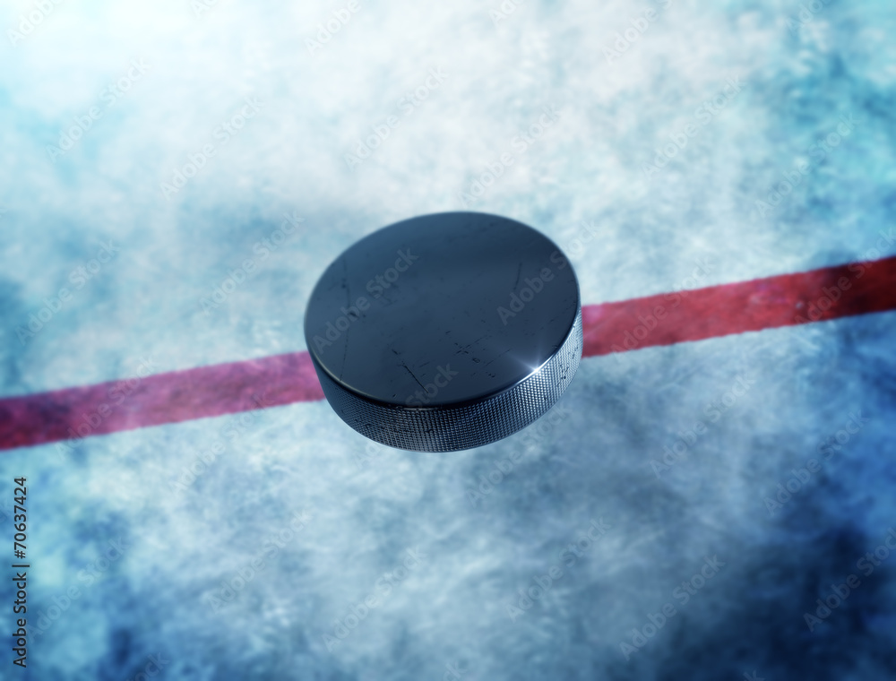 Naklejka premium Hockey puck above the ice with red line