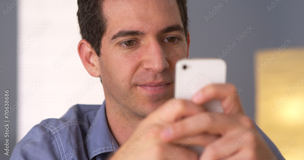 Man texting on smartphone