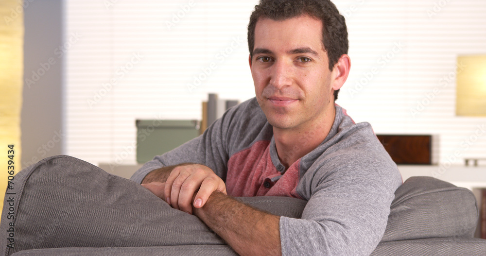 Casual man sitting on couch Casual man sitting on couch