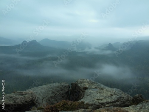 Cold misty blue morning. A minute before sunrise in valley