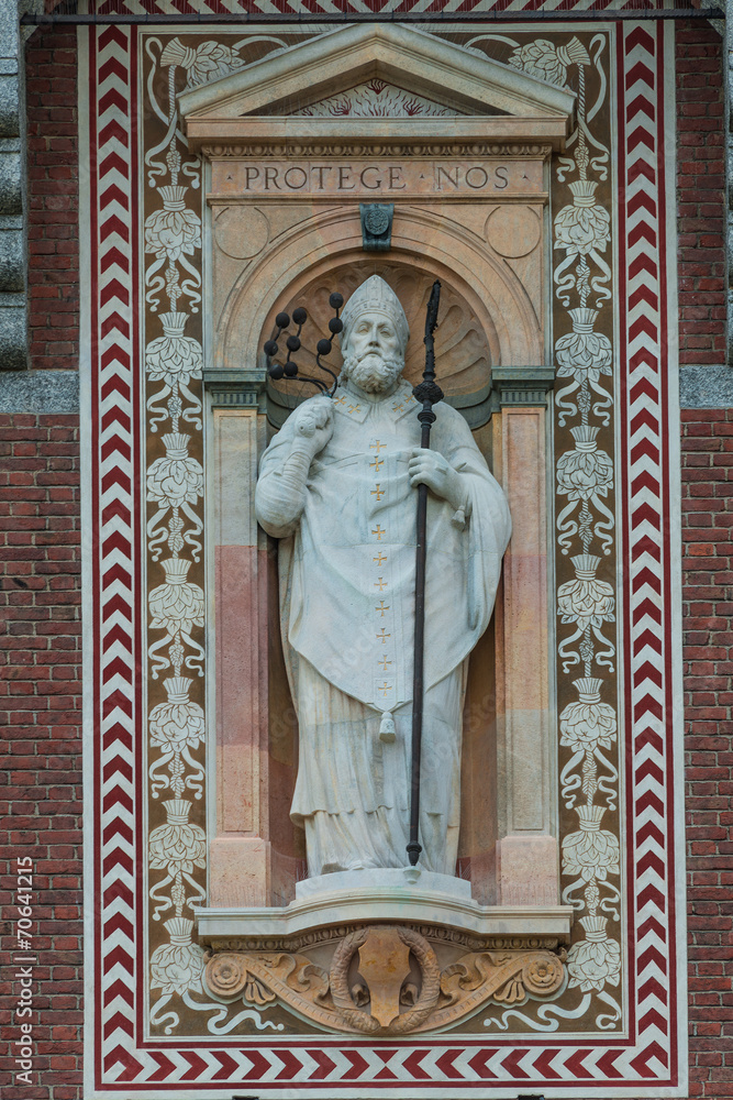 Statue of a prist in Courtyard of Castello Sforzesco, Milan, Ita