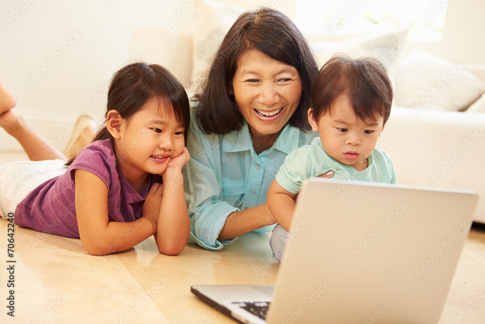 Grandmother And Grandchildren Using Laptop Together Grandmother And Grandchildren Using Laptop Together