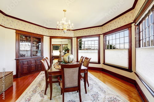 Luxury dining room with wood trim and built-in cabinet