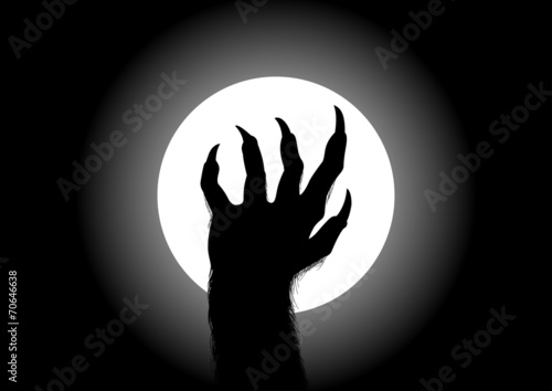 Photo Silhouette illustration of werewolf hand against the full moon