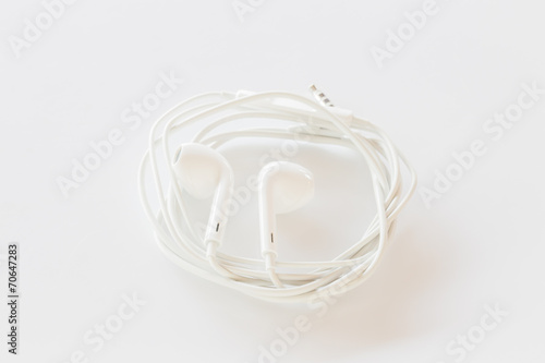 Smartphone ear buds isolated on white background