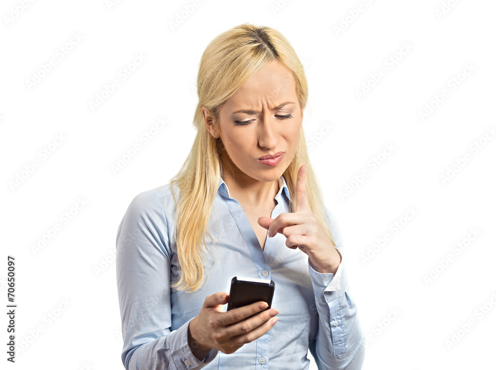 Portrait angry business woman pointing finger at smartphone Portrait angry business woman pointing finger at smartphone