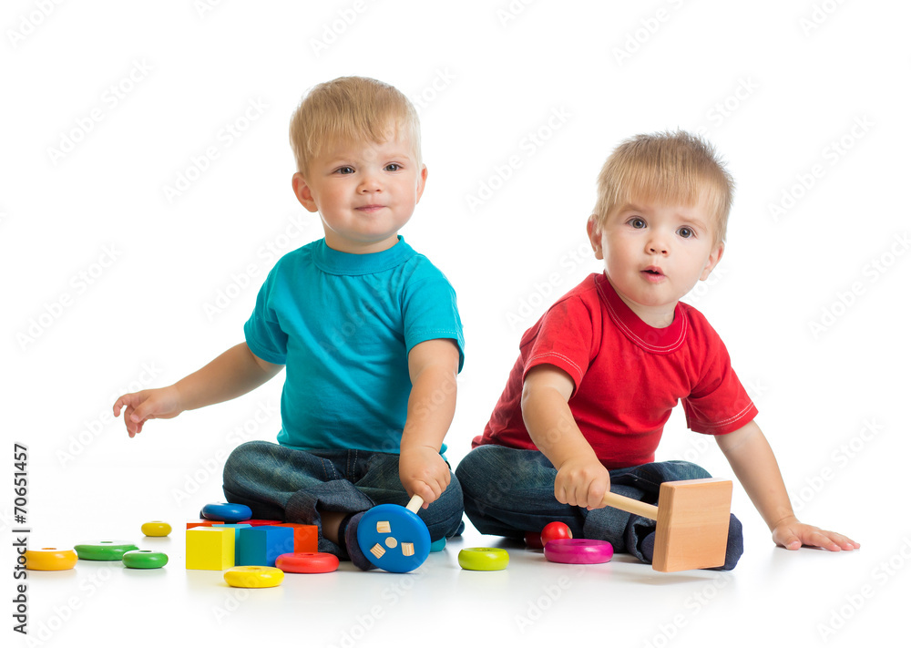 Happy children playing by mallet or hammer Happy children playing by mallet or hammer