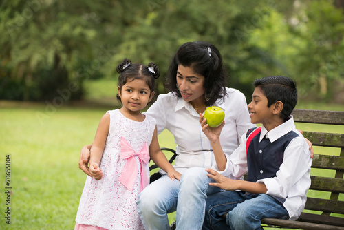 indian family outdoor eating healthy photo