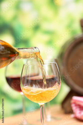 Wine pouring into wine glass, close-up