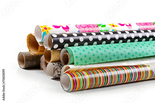 rolls of colorful wrapping paper isolated on white
