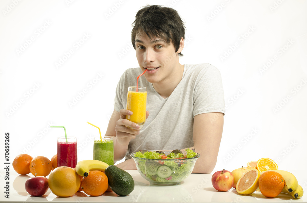 Man having a table full of organic food,juices, organic smoothie