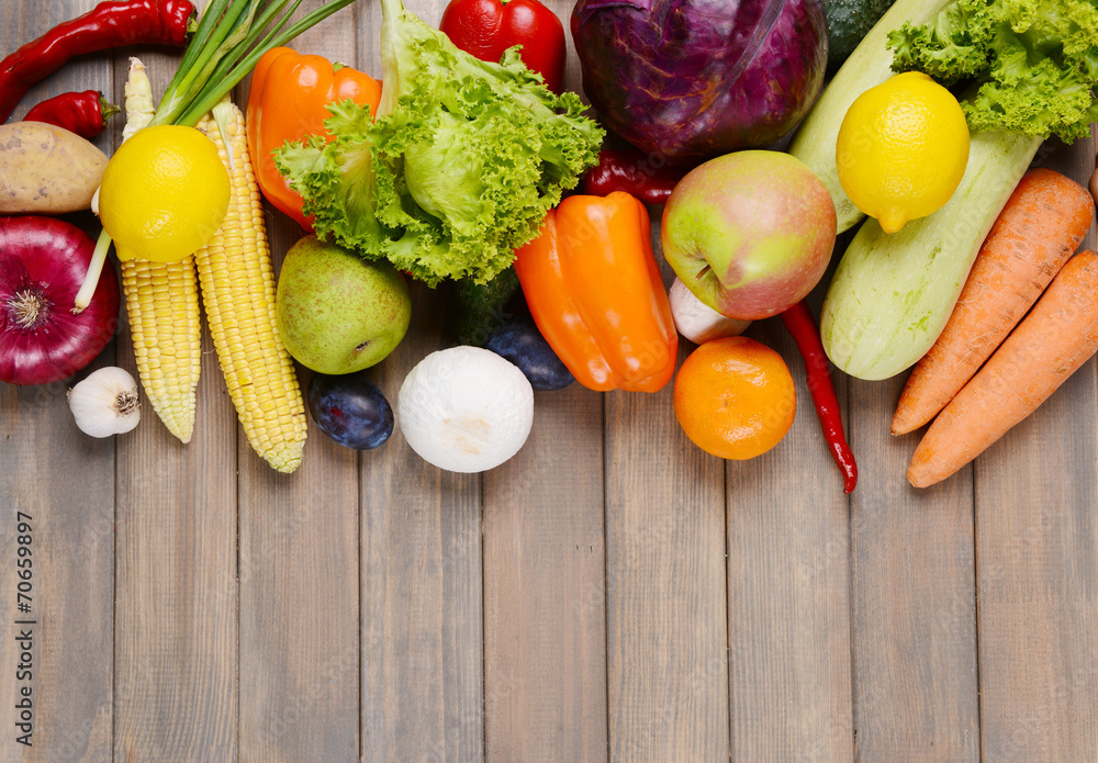 Fresh organic fruits and vegetables on wooden background Fresh organic fruits and vegetables on wooden background