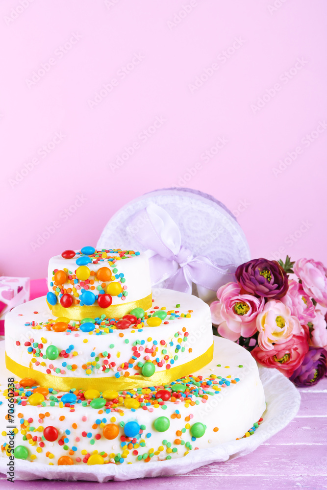 Beautiful tasty birthday cake and gifts on color background Beautiful tasty birthday cake and gifts on color background