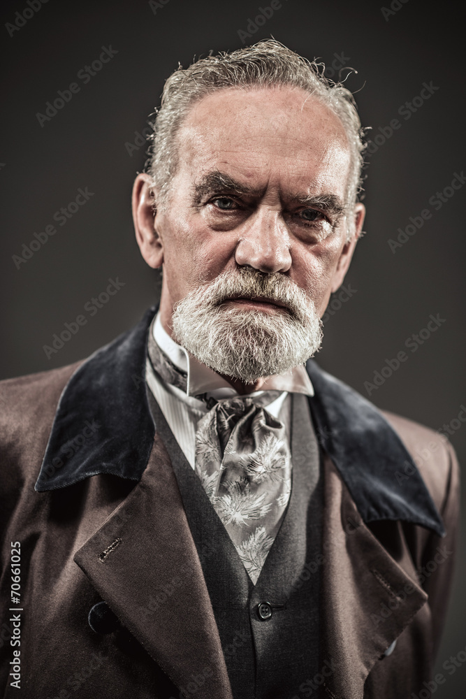 Obraz premium Vintage characteristic senior man with gray hair and beard. Stud
