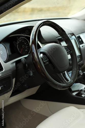 Modern car interior. Steering wheel, close-up © Africa Studio