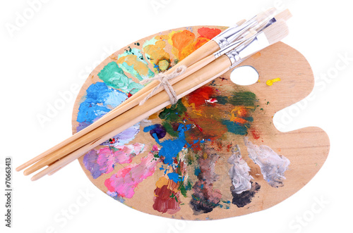 Paint brushes and palette isolated on white