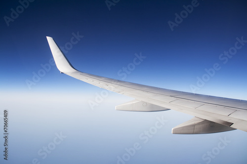 wing aeroplane over blue sky