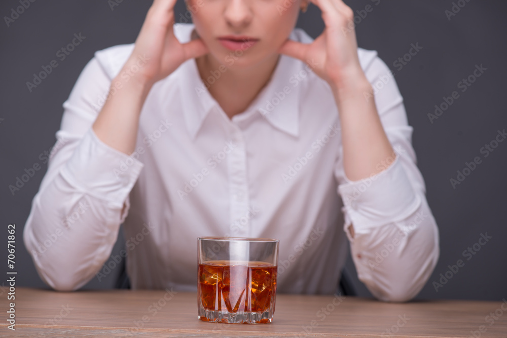 Serious woman wearing white blouse