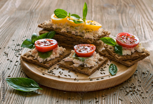 rye bread with cheese, tomatoes, basil and thyme