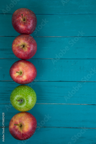 Farm fresh organic red and green apples on wooden table