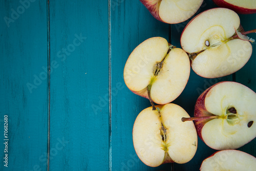 fresh organic apples halves on wooden kitchen table background