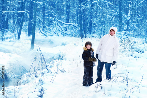 Father and son in a snowy park