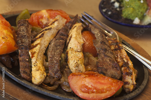 steak and chicken fajitas with gucamole photo